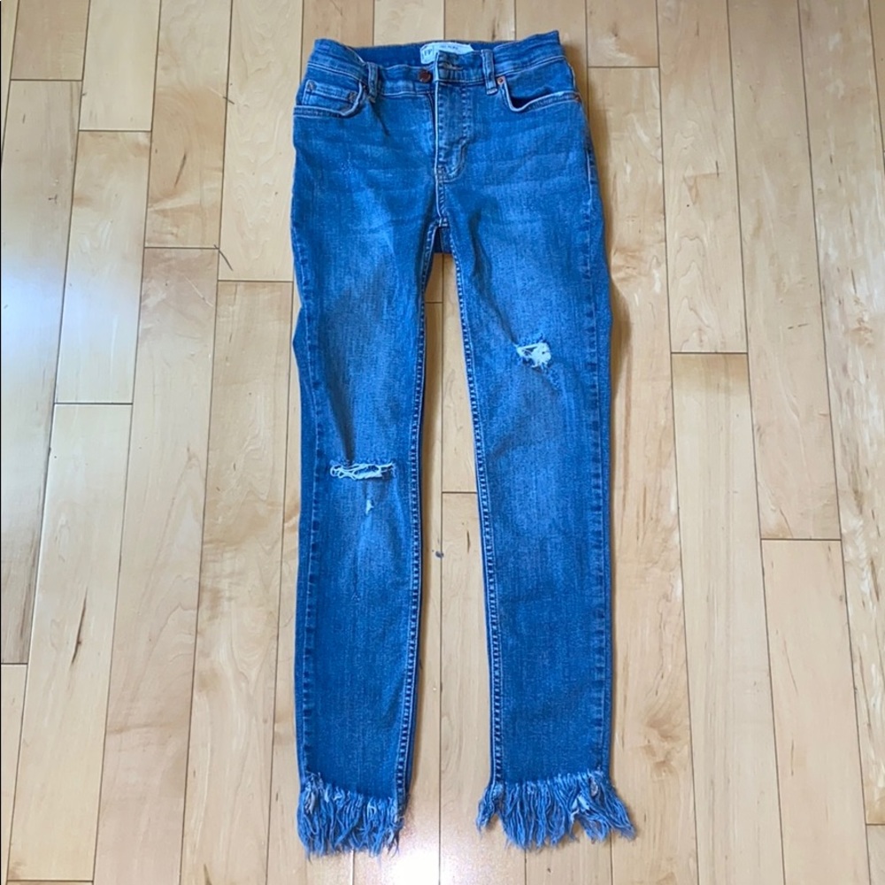 Free People ripped jeans with fringe bottom